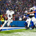 Jan 19, 2025; Orchard Park, New York, USA; Baltimore Ravens quarterback Lamar Jackson (8) runs the ball during the fourth quarter against the Buffalo Bills in a 2025 AFC divisional round game at Highmark Stadium. Mandatory Credit: Gregory Fisher-Imagn Images