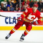 Jan 23, 2025; Calgary, Alberta, CAN; Calgary Flames left wing Andrei Kuzmenko (96) skates against the Buffalo Sabres during the first period at Scotiabank Saddledome. Mandatory Credit: Sergei Belski-Imagn Images