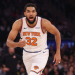 Jan 27, 2025; New York, New York, USA; New York Knicks center Karl-Anthony Towns (32) reacts after makes a three point basket during the first half against the Memphis Grizzlies at Madison Square Garden.