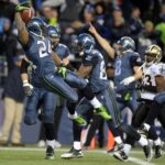 Jan 8, 2010; Seattle, WA, USA; Seattle Seahawks running back Marshawn Lynch (24) leaps into the end zone to score on a 67-yard touchdown run in the fourth quarter of the NFC Wild Card playoff game against the New Orleans Saints at Qwest Field. Mandatory Credit: Kirby Lee/Image of Sport-USA TODAY Sports