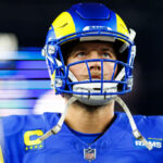 GLENDALE, ARIZONA - JANUARY 13: Quarterback Matthew Stafford #9 of the Los Angeles Rams stands on the field prior to an NFC Wild Card game against the Minnesota Vikings, at State Farm Stadium on January 13, 2025 in Glendale, Arizona.