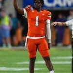 Dec 28, 2024; Orlando, FL, USA; Miami Hurricanes quarterback Cam Ward (1) gestures during the second half against the Iowa State Cyclones at Camping World Stadium.