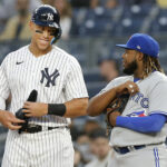 NEW YORK, NEW YORK - APRIL 13: Aaron Judge #99 of the New York Yankees and Vladimir Guerrero Jr. #27 of the Toronto Blue Jays have a laugh at first base during the first inning at Yankee Stadium on April 13, 2022 in New York City. (Photo by Jim McIsaac/Getty Images) Vladimir Guerrero Jr.
