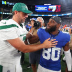 EAST RUTHERFORD, NEW JERSEY - AUGUST 26: Jamison Crowder #80 of the New York Giants and Aaron Rodgers #8 of the New York Jets hug following a preseason game at MetLife Stadium on August 26, 2023 in East Rutherford, New Jersey. (Photo by Mike Stobe/Getty Images) Aaron Rodgers