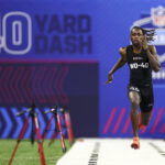 INDIANAPOLIS, INDIANA - MARCH 2: Xavier Worthy #WO40 of Texas runs the 40-yard dash during the NFL Combine at Lucas Oil Stadium on March 2, 2024 in Indianapolis, Indiana. (Photo by Kevin Sabitus/Getty Images) NFL Combine