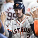 HOUSTON, TX - AUGUST 21: Alex Bregman #2 of the Houston Astros celebrates reacts in the dugout after hitting a solo home run in the first inning during the game between the Boston Red Sox and the Houston Astros at Minute Maid Park on Wednesday, August 21, 2024 in Houston, Texas. (Photo by Logan Riely/MLB Photos via Getty Images)