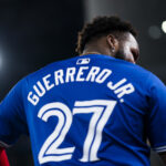TORONTO, ON - SEPTEMBER 28: Vladimir Guerrero Jr. #27 of Toronto Blue Jays looks on from the dugout before playing against the Miami Marlins in their MLB game at the Rogers Centre on September 28, 2024 in Toronto, Ontario, Canada. (Photo by Mark Blinch/Getty Images)