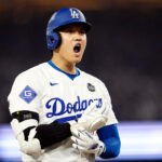 LOS ANGELES, CA - OCTOBER 25: Shohei Ohtani #17 of the Los Angeles Dodgers reacts to advancing to third base on an error the eighth inning during Game 1 of the 2024 World Series presented by Capital One between the New York Yankees and the Los Angeles Dodgers at Dodger Stadium on Friday, October 25, 2024 in Los Angeles, California. (Photo by Mary DeCicco/MLB Photos via Getty Images)