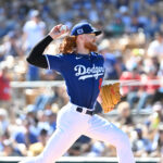 GLENDALE, ARIZONA - FEBRUARY 23: Dustin May #85 of the Los Angeles Dodgers delivers a first inning pitch during their Spring training game against the San Diego Padres on February 23, 2025 at Camelback Ranch in Glendale, Arizona. (Photo by Norm Hall/Getty Images)