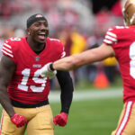 Jan 8, 2023; Santa Clara, California, USA; San Francisco 49ers wide receiver Deebo Samuel (19) gestures with tight end George Kittle (85) before the game against the Arizona Cardinals at Levi's Stadium. Mandatory Credit: Darren Yamashita-USA TODAY Sports