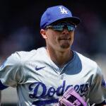 Jun 20, 2024; Denver, Colorado, USA; Los Angeles Dodgers third baseman Kike Hernandez (8) runs to the dugout at the end of the fifth inning against the Colorado Rockies at Coors Field. Mandatory Credit: Isaiah J. Downing-USA TODAY Sports