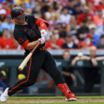 Aug 30, 2024; Cincinnati, Ohio, USA; Cincinnati Reds first baseman Ty France (2) hits a single in the second inning against the Milwaukee Brewers at Great American Ball Park. Mandatory Credit: Katie Stratman-USA TODAY Sports