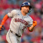 Sep 13, 2024; Anaheim, California, USA; Houston Astros second baseman Jose Altuve (27) runs after hitting a single against the Los Angeles Angels during the first inning at Angel Stadium. Mandatory Credit: Gary A. Vasquez-Imagn Images