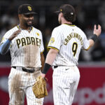 Sep 16, 2024; San Diego, California, USA; San Diego Padres shortstop Xander Bogaerts (2) and second baseman Jake Cronenworth (9) celebrate on the field after defeating the Houston Astros at Petco Park. Mandatory Credit: Orlando Ramirez-Imagn Images