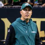 Sep 22, 2024; New Orleans, Louisiana, USA; Philadelphia Eagles offensive coordinator Kellen Moore looks on during warmups before the game against the New Orleans Saints at Caesars Superdome. Mandatory Credit: Stephen Lew-Imagn Images