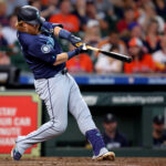 Sep 25, 2024; Houston, Texas, USA; Seattle Mariners first baseman Justin Turner (2) hits an RBI single to left field against the Houston Astros during the sixth inning at Minute Maid Park. Mandatory Credit: Erik Williams-Imagn Images