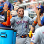 Sep 30, 2024; Atlanta, Georgia, USA; New York Mets catcher Francisco Alvarez (4) celebrates with teammates after scoring a run against the Atlanta Braves in the eighth inning at Truist Park. Mandatory Credit: Brett Davis-Imagn Images