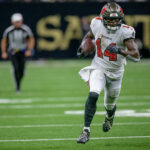 Oct 13, 2024; New Orleans, Louisiana, USA; Tampa Bay Buccaneers wide receiver Chris Godwin (14) runs in for a touchdown during the third quarter against the New Orleans Saints at Caesars Superdome. Mandatory Credit: Matthew Hinton-Imagn Images