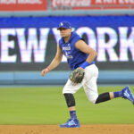 Oct 24, 2024; Los Angeles, CA, USA; Los Angeles Dodgers shortstop Miguel Rojas (11) during the team workout prior to game one of the World Series against the New York Yankees at Dodger Stadium. Mandatory Credit: Jayne Kamin-Oncea-Imagn Images