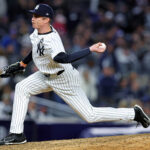 Oct 28, 2024; New York, New York, USA; New York Yankees pitcher Tim Hill (54) pitches during the seventh inning against the Los Angeles Dodgers in game three of the 2024 MLB World Series at Yankee Stadium. Mandatory Credit: Brad Penner-Imagn Images
