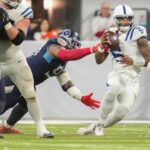Indianapolis Colts quarterback Anthony Richardson (5) is sacked by Tennessee Titans defensive tackle Jeffery Simmons (98) on Sunday, Dec. 22, 2024, during a game against the Tennessee Titans at Lucas Oil Stadium in Indianapolis.