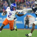 Boise State Broncos running back Ashton Jeanty (2) runs past Penn State Nittany Lions linebacker Kobe King (41) during their Vrbo Fiesta Bowl matchup at State Farm Stadium on Dec. 31, 2024.