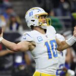 Jan 11, 2025; Houston, Texas, USA; Los Angeles Chargers quarterback Justin Herbert (10) looks to pass during the second quarter against the Houston Texans in an AFC wild card game at NRG Stadium. Mandatory Credit: Troy Taormina-Imagn Images