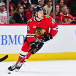 Feb 5, 2025; Chicago, Illinois, USA; Chicago Blackhawks center Connor Bedard (98) skates with the puck against the Edmonton Oilers during the second period at the United Center. Mandatory Credit: Daniel Bartel-Imagn Images