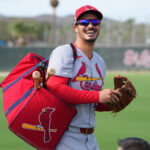 Feb 17, 2025; Jupiter, FL, USA; St. Louis Cardinals third base Nolan Arenado (28) laughs as he heads off to a workout station at spring training. Mandatory Credit: Jim Rassol-Imagn Images