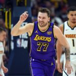 Feb 22, 2025; Denver, Colorado, USA; Los Angeles Lakers guard Luka Doncic (77) celebrates after a basket during the first half against the Denver Nuggets at Ball Arena.
