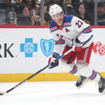 Feb 23, 2025; Pittsburgh, Pennsylvania, USA; New York Rangers defenseman Adam Fox (23) handles the puck against the Pittsburgh Penguins during the first period at PPG Paints Arena. Mandatory Credit: Charles LeClaire-Imagn Images