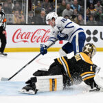 Feb 25, 2025; Boston, Massachusetts, USA; Toronto Maple Leafs right wing Mitch Marner (16) scores a goal on Boston Bruins goaltender Jeremy Swayman (1) during an overtime period at the TD Garden. Mandatory Credit: Brian Fluharty-Imagn Images