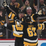 Feb 27, 2025; Pittsburgh, Pennsylvania, USA; Pittsburgh Penguins center Evgeni Malkin (left) celebrates his game winning goal in overtime with right wing Rickard Rakell (67) against the Philadelphia Flyers at PPG Paints Arena. Mandatory Credit: Charles LeClaire-Imagn Images