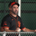 Feb 13, 2025; Scottsdale, AZ, USA; San Francisco Giants pitcher Justin Verlander (35) watches players work out in the bullpen during spring training camp.
