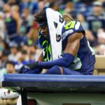 Seattle Seahawks cornerback Artie Burns (23) rides a cart to the locker room following an injury during the second quarter against the Cleveland Browns at Lumen Field.