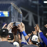 NEW YORK, NY - OCTOBER 30: The Los Angeles Dodgers celebrate with the Commissioner's Trophy after winning Game 5 of the 2024 World Series presented by Capital One between the Los Angeles Dodgers and the New York Yankees at Yankee Stadium on Wednesday, October 30, 2024 in New York, New York. The Los Angeles Dodgers won 7-6. (Photo by Rob Tringali/MLB Photos via Getty Images) MLB