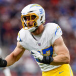 HOUSTON, TEXAS - JANUARY 11: Joey Bosa #97 of the Los Angeles Chargers runs around the edge during the first half of the AFC Wild Card Playoff game against the Houston Texans at NRG Stadium on January 11, 2025 in Houston, Texas. (Photo by Brandon Sloter/Getty Images)