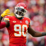 Dec 25, 2023; Kansas City, Missouri, USA; Kansas City Chiefs defensive end Charles Omenihu (90) rallies the crowd during the second half against the Las Vegas Raiders at GEHA Field at Arrowhead Stadium. Mandatory Credit: Jay Biggerstaff-USA TODAY Sports