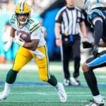 Dec 24, 2023; Charlotte, North Carolina, USA; Green Bay Packers running back AJ Dillon (28) against the Carolina Panthers during the second half at Bank of America Stadium.