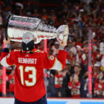 Jun 24, 2024; Sunrise, Florida, USA; Florida Panthers center Sam Reinhart (13) kisses the cup after winning game seven of the 2024 Stanley Cup Final against the Edmonton Oilers at Amerant Bank Arena. Mandatory Credit: Sam Navarro-USA TODAY Sports