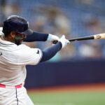 Sep 5, 2024; St. Petersburg, Florida, USA; Tampa Bay Rays first baseman Yandy Diaz (2) hits an rbi double against the Minnesota Twins in the seventh inning at Tropicana Field. Mandatory Credit: Nathan Ray Seebeck-Imagn Images