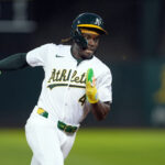 Sep 6, 2024; Oakland, California, USA; Oakland Athletics right fielder Lawrence Butler (4) runs to third base against the Detroit Tigers during the fourth inning at Oakland-Alameda County Coliseum. Mandatory Credit: Darren Yamashita-Imagn Images
