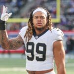 Dec 8, 2024; East Rutherford, New Jersey, USA; New Orleans Saints defensive end Chase Young (99) looks up at fans before the game against the New York Giants at MetLife Stadium. Mandatory Credit: Vincent Carchietta-Imagn Images