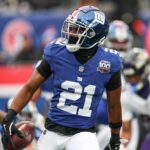 Dec 15, 2024; East Rutherford, New Jersey, USA; New York Giants cornerback Adoree' Jackson (21) celebrates after receiving a fumble against the Baltimore Ravens during the first quarter at MetLife Stadium.