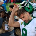New York Jets quarterback Aaron Rodgers (8) takes off his helmet after the game Sunday, Dec. 15, 2024 at EverBank Stadium in Jacksonville, Fla. The Jets held off the Jaguars 32-25. [Corey Perrine/Florida Times-Union]