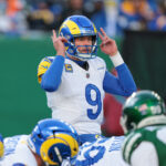 Dec 22, 2024; East Rutherford, New Jersey, USA; Los Angeles Rams quarterback Matthew Stafford (9) signals during the second half against the New York Jets at MetLife Stadium. Mandatory Credit: Vincent Carchietta-Imagn Images