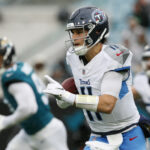 Dec 29, 2024; Jacksonville, Florida, USA; Tennessee Titans quarterback Mason Rudolph (11) runs the ball against the Jacksonville Jaguars during the first quarter at EverBank Stadium. Mandatory Credit: Morgan Tencza-Imagn Images