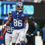 Dec 29, 2024; East Rutherford, New Jersey, USA; New York Giants wide receiver Darius Slayton (86) celebrates after scoring a touchdown reception during the first half against the Indianapolis Colts at MetLife Stadium. Mandatory Credit: Vincent Carchietta-Imagn Images