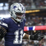 Jan 5, 2025; Arlington, Texas, USA; Dallas Cowboys linebacker Micah Parsons (11) celebrates after a sack during the first quarter against the Washington Commanders at AT&T Stadium. Mandatory Credit: Kevin Jairaj-Imagn Images