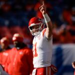 Jan 5, 2025; Denver, Colorado, USA; Kansas City Chiefs quarterback Carson Wentz (11) before the game against the Denver Broncos at Empower Field at Mile High.